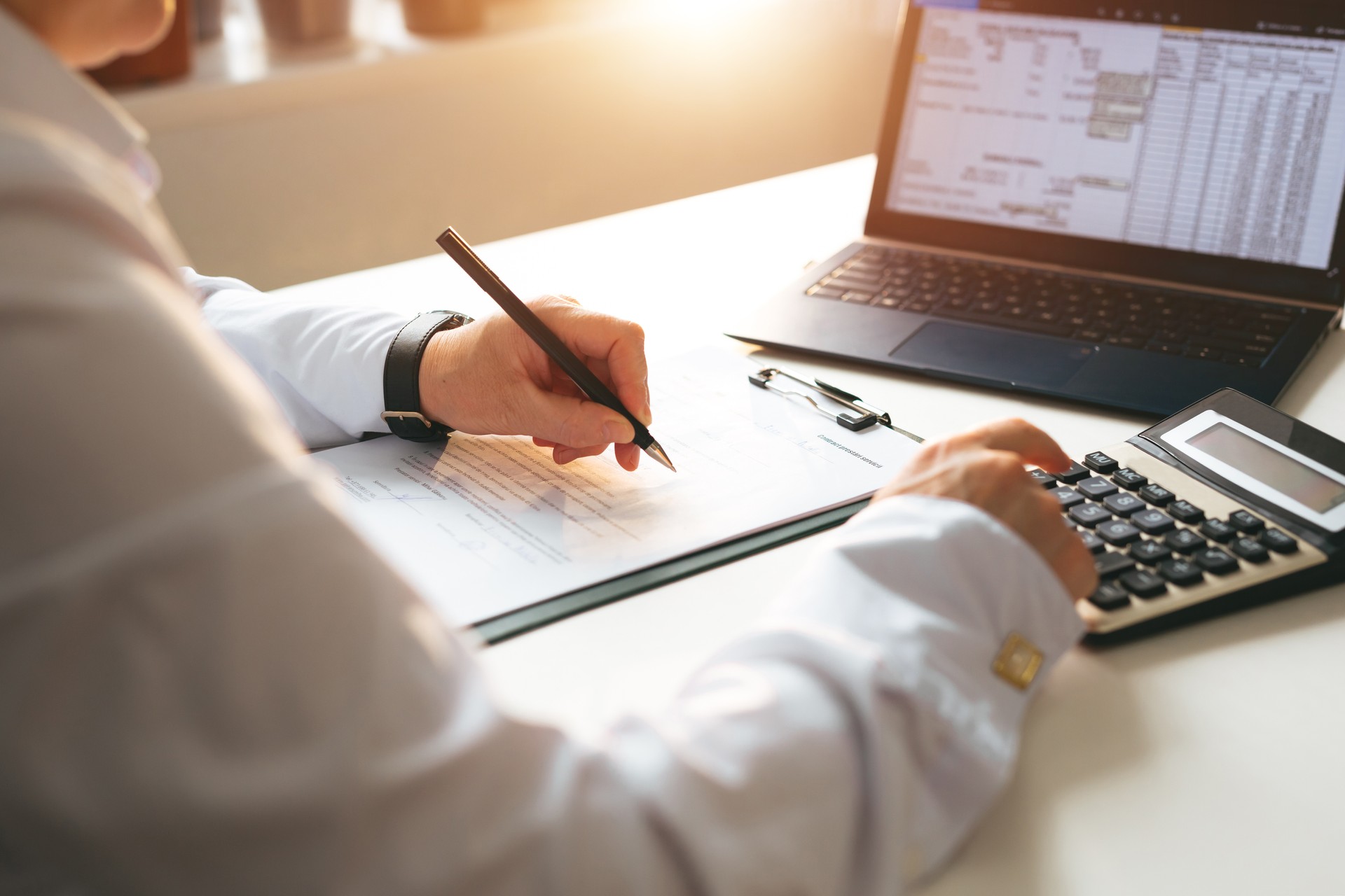 Accountant calculating the financial statement of his business. Business panoramic  banner with  copy space. Bookkeeper and Accountant.