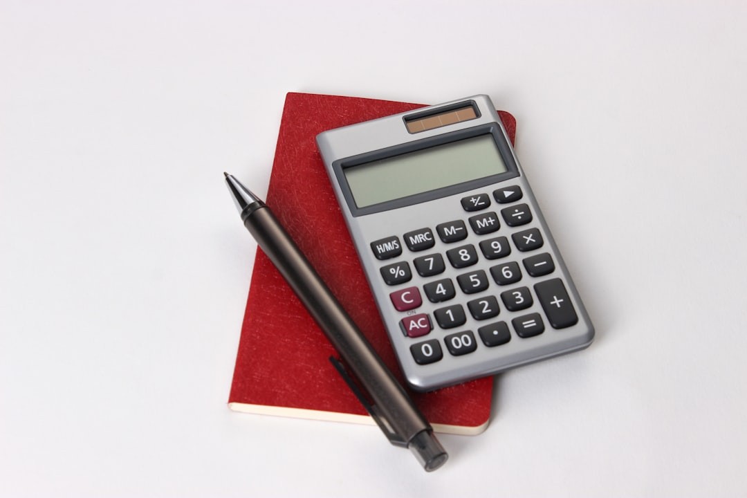 black and silver calculator beside black pen.Accountant and bookkeeper. Accounting, Bookkeeping, small business, accounts receivable, accounts payable. In Mesa Arizona, Tempe Arizona, Chandler Arizona, Phoenix Arizona, Gilbert Arizona